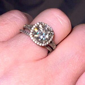 3 carat cushion cut Moissanite Stone with CZ side stones and matching CZ band.